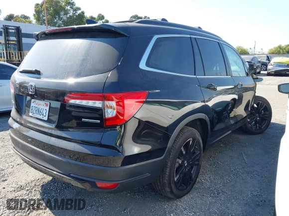 2022 Honda Pilot Special Edition with VIN 5FNYF5H24NB011709, listed as a IAAI auction lot 42604120 with 57,676 mi miles and . Bid and sale history available at DreamBid. Image 4.