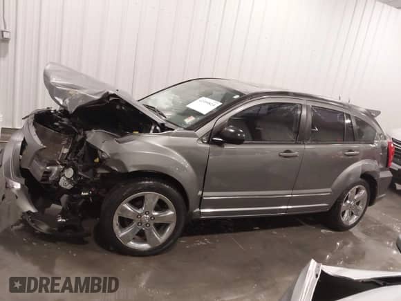 2011 Dodge Caliber Rush with VIN 1B3CB8HB2BD296051, listed as a IAAI auction lot 42399823 with 121,008 mi miles and . Bid and sale history available at DreamBid. Image 15.