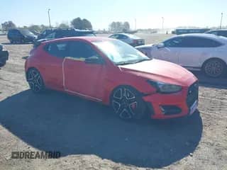 2021 Hyundai Veloster z VIN KMHT36AHXMU009603, wystawiony jako IAAI lot #41887823 z przebiegiem 44 934 mil mil oraz . Historia ofert i sprzedaży dostępna na DreamBid. Obrazek 1.