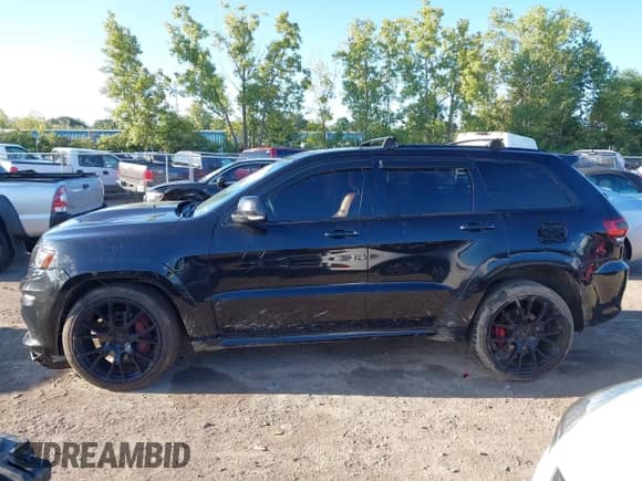 2014 Jeep Grand Cherokee SRT-8 с VIN 1C4RJFDJ4EC472220, выставлен на аукционе IAAI как лот 43057466 с пробегом 99 254 миль миль и . История ставок и продаж доступна на DreamBid. Изображение 13.