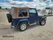 2003 Jeep Wrangler X z VIN 1J4FA39S33P356428, wystawiony jako Copart lot #70285135 z przebiegiem 147 788 mil mil oraz Szkoda całkowita • Salvage title. Historia ofert i sprzedaży dostępna na DreamBid. Obrazek 3.