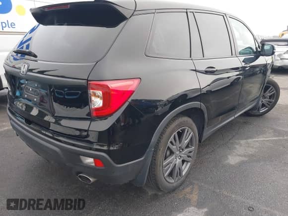 2021 Honda Passport EX-L with VIN 5FNYF7H5XMB013923, listed as a IAAI auction lot 41669295 with 42,969 mi miles and . Bid and sale history available at DreamBid. Image 4.