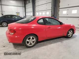 2001 Hyundai Tiburon с VIN KMHJG25F01U226912, выставлен на аукционе Copart как лот 89357135 с пробегом 131 487 миль миль и Чистый • Clean title. История ставок и продаж доступна на DreamBid. Изображение 3.