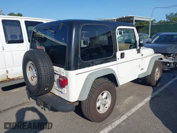2002 Jeep Wrangler X z VIN 1J4FA39S32P776088, wystawiony jako IAAI lot #43183058 z przebiegiem 80 642 mil mil oraz . Historia ofert i sprzedaży dostępna na DreamBid. Obrazek 4.
