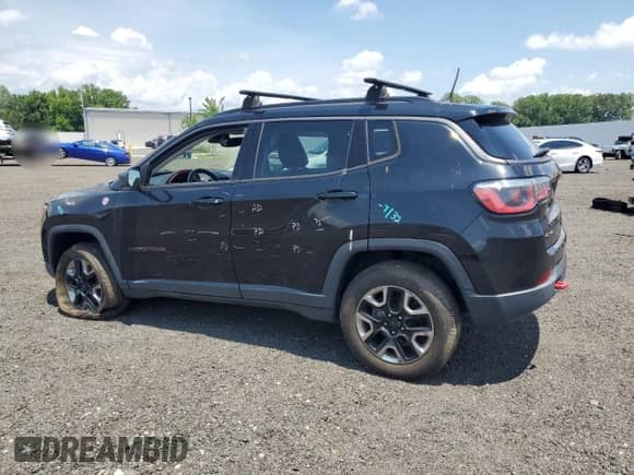 2017 Jeep Compass Trailhawk with VIN 3C4NJDDB6HT631761, listed as a Copart auction lot 62759555 with 94,528 mi miles and Salvage title. Bid and sale history available at DreamBid. Image 2.