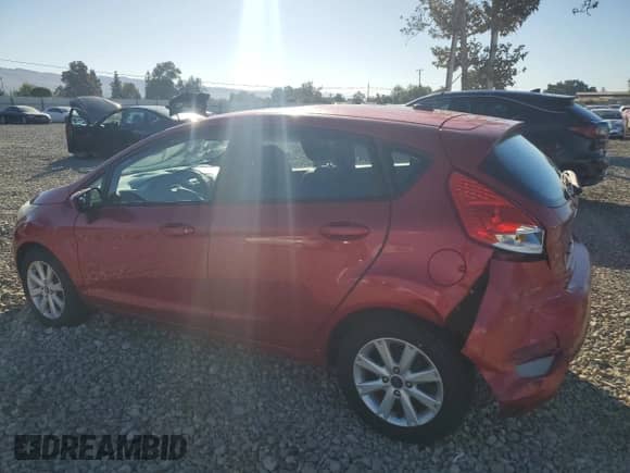 2012 Ford Fiesta SE with VIN 3FADP4EJ7CM173494, listed as a Copart auction lot 82229335 with 83,628 mi miles and Salvage title. Bid and sale history available at DreamBid. Image 2.