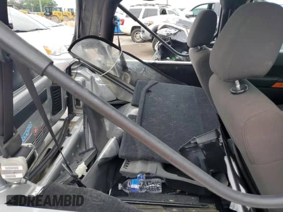 2012 Jeep Wrangler Sport с VIN 1C4AJWAG6CL267694, выставлен на аукционе Copart как лот 63449144 с пробегом 86 642 миль миль и Списание • Salvage title. История ставок и продаж доступна на DreamBid. Изображение 11.