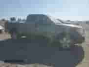 2005 Nissan Frontier SE with VIN 1N6AD06U85C465325, listed as a Copart auction lot 63933605 with 266,550 mi miles and Salvage title. Bid and sale history available at DreamBid. Image 4.