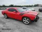 2014 Dodge Challenger R/T with VIN 2C3CDYBT8EH177264, listed as a Copart auction lot 70327855 with 105,628 mi miles and Salvage title. Bid and sale history available at DreamBid. Image 4.