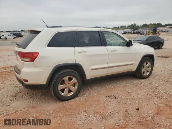 2012 Jeep Grand Cherokee Laredo z VIN 1C4RJEAG3CC251515, wystawiony jako Copart lot #83939905 z przebiegiem 131 869 mil mil oraz Szkoda całkowita • Salvage title. Historia ofert i sprzedaży dostępna na DreamBid. Obrazek 3.