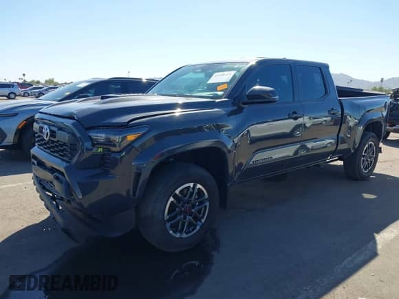 2024 Toyota Tacoma SR5 with VIN 3TMLB5FN8RM005075, listed as a IAAI auction lot 43290415 with 20,318 mi miles and . Bid and sale history available at DreamBid. Image 2.