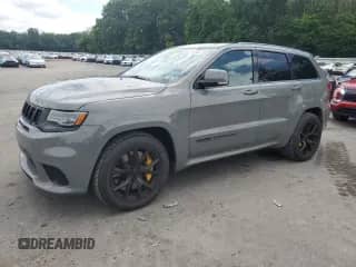 2021 Jeep Grand Cherokee Trackhawk z VIN 1C4RJFN96MC659042, wystawiony jako Copart lot #65164445 z przebiegiem 9 356 mil mil oraz Czysty tytuł • Clean title. Historia ofert i sprzedaży dostępna na DreamBid. Obrazek 1.