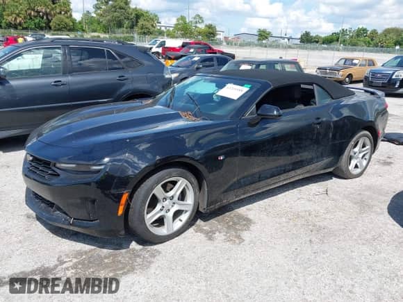 2020 Chevrolet Camaro 1LT with VIN 1G1FB3DS4L0105705, listed as a IAAI auction lot 43210588 with 84,523 mi miles and . Bid and sale history available at DreamBid. Image 2.
