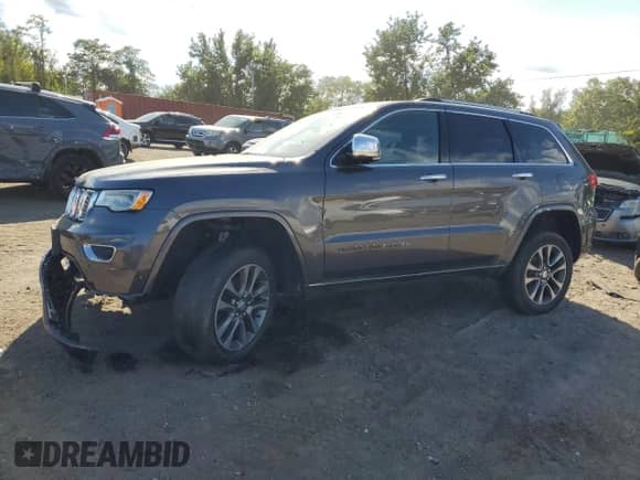 2017 Jeep Grand Cherokee Overland with VIN 1C4RJFCG3HC694208, listed as a Copart auction lot 71187645 with 67,455 mi miles and Salvage title. Bid and sale history available at DreamBid. Image 1.