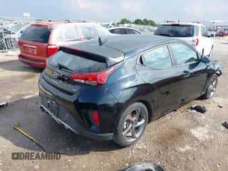 2019 Hyundai Veloster 2.0 z VIN KMHTG6AF3KU016554, wystawiony jako IAAI lot #37580702 z przebiegiem 79 286 mil mil oraz . Historia ofert i sprzedaży dostępna na DreamBid. Obrazek 4.