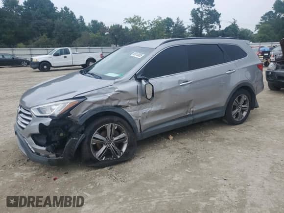 2014 Hyundai Santa Fe Limited with VIN KM8SNDHF3EU079878, listed as a Copart auction lot 68010885 with 127,975 mi miles and Salvage title. Bid and sale history available at DreamBid. Image 1.
