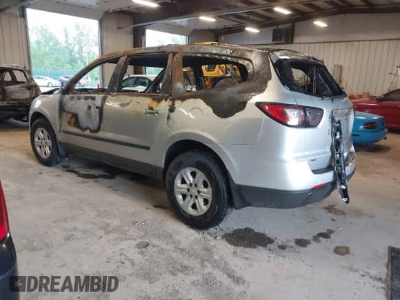 2015 Chevrolet Traverse LS z VIN 1GNKVFKD8FJ375092, wystawiony jako IAAI lot #42559831 z przebiegiem 138 891 mil mil oraz . Historia ofert i sprzedaży dostępna na DreamBid. Obrazek 3.