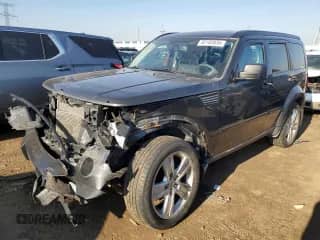 2011 Dodge Nitro Heat with VIN 1D4PU4GX6BW584176, listed as a Copart auction lot 52102035 with 185,608 mi miles and Salvage title. Bid and sale history available at DreamBid. Image 1.