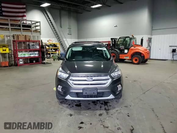 2018 Ford Escape SE с VIN 1FMCU9GD7JUC08364, выставлен на аукционе Copart как лот 71776605 с пробегом 112 210 миль миль и Списание • Salvage title. История ставок и продаж доступна на DreamBid. Изображение 14.
