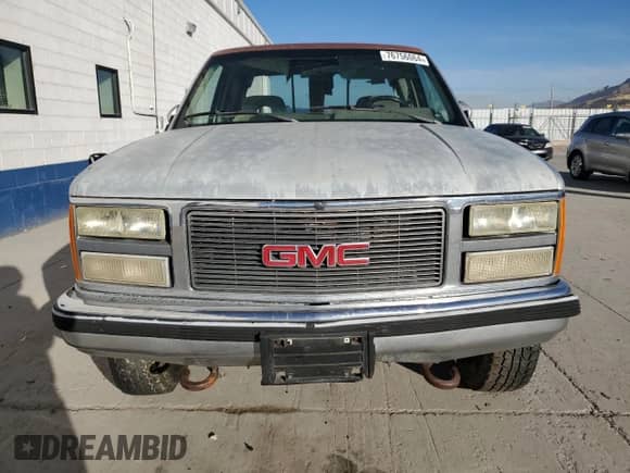 1992 GMC Sierra 1500 z VIN 2GTEK19K0N1519801, wystawiony jako Copart lot #76756064 z przebiegiem 325 350 mil mil oraz Czysty tytuł • Clean title. Historia ofert i sprzedaży dostępna na DreamBid. Obrazek 5.