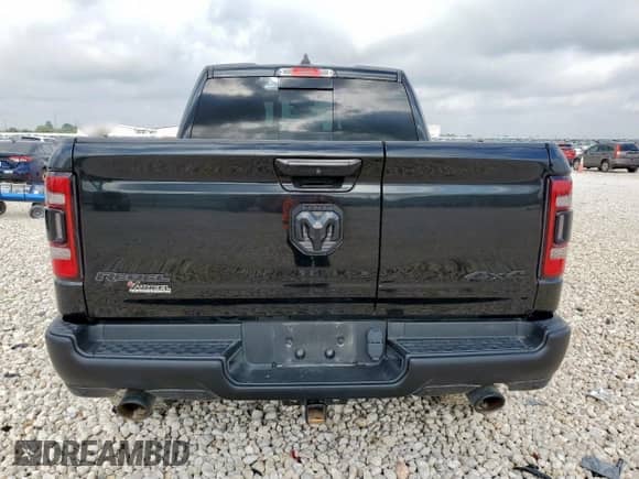 2020 Ram 1500 Rebel z VIN 1C6SRFLT6LN127034, wystawiony jako Copart lot #64791005 z przebiegiem 86 689 mil mil oraz Szkoda całkowita • Salvage title. Historia ofert i sprzedaży dostępna na DreamBid. Obrazek 6.