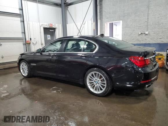 2013 BMW 7 Series 750i xDrive with VIN WBAYB6C59DD223852, listed as a Copart auction lot 49304695 with 124,989 mi miles and Salvage title. Bid and sale history available at DreamBid. Image 2.