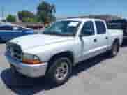2003 Dodge Dakota SLT with VIN 1D7HL48N03S184534, listed as a IAAI auction lot 42423520 with 197,070 mi miles and . Bid and sale history available at DreamBid. Image 6.