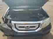 2011 Honda Pilot LX z VIN 5FNYF3H2XBB015358, wystawiony jako Copart lot #68182175 z przebiegiem Nie podano mil oraz Szkoda całkowita • Salvage title. Historia ofert i sprzedaży dostępna na DreamBid. Obrazek 11.