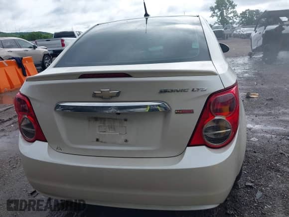2014 Chevrolet Sonic LTZ with VIN 1G1JE5SB5E4122735, listed as a IAAI auction lot 42327595 with 163,912 mi miles and . Bid and sale history available at DreamBid. Image 16.