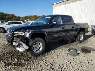 2002 Dodge Dakota SLT z VIN 1B7HG48Z42S670117, wystawiony jako Copart lot #75222474 z przebiegiem 91 094 mil mil oraz Szkoda całkowita • Salvage title. Historia ofert i sprzedaży dostępna na DreamBid. Obrazek 1.