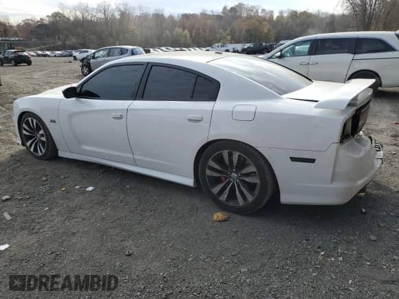 2013 Dodge Charger SRT-8 with VIN 2C3CDXEJ1DH527031, listed as a Copart auction lot 77995994 with 145,051 mi miles and Salvage title. Bid and sale history available at DreamBid. Image 2.