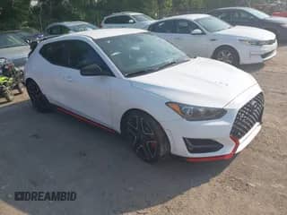 2021 Hyundai Veloster z VIN KMHT36AH7MU010143, wystawiony jako IAAI lot #42407678 z przebiegiem 43 444 mil mil oraz . Historia ofert i sprzedaży dostępna na DreamBid. Obrazek 1.