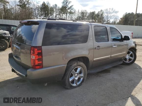 2014 Chevrolet Suburban LTZ with VIN 1GNSCKE03ER151784, listed as a Copart auction lot 43482165 with 247,413 mi miles and Salvage title. Bid and sale history available at DreamBid. Image 3.