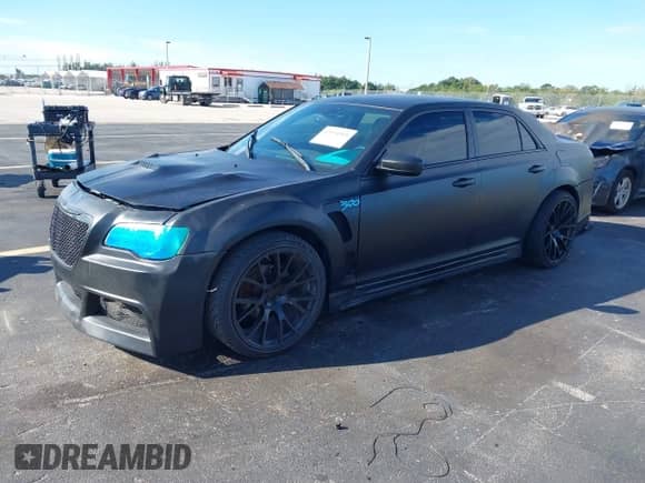 2012 Chrysler 300 z VIN 2C3CCAAG2CH237874, wystawiony jako IAAI lot #43434568 z przebiegiem 87 998 mil mil oraz . Historia ofert i sprzedaży dostępna na DreamBid. Obrazek 2.