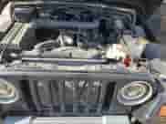 1998 Jeep Wrangler Sport z VIN 1J4FY19SXWP734488, wystawiony jako Copart lot #81896775 z przebiegiem 180 236 mil mil oraz Czysty tytuł • Clean title. Historia ofert i sprzedaży dostępna na DreamBid. Obrazek 11.