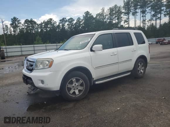 2010 Honda Pilot Touring with VIN 5FNYF4H82AB029490, listed as a Copart auction lot 67353785 with 205,064 mi miles and Salvage title. Bid and sale history available at DreamBid. Image 1.