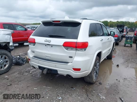 2018 Jeep Grand Cherokee Overland with VIN 1C4RJFCG1JC405736, listed as a IAAI auction lot 43296562 with 91,589 mi miles and . Bid and sale history available at DreamBid. Image 4.