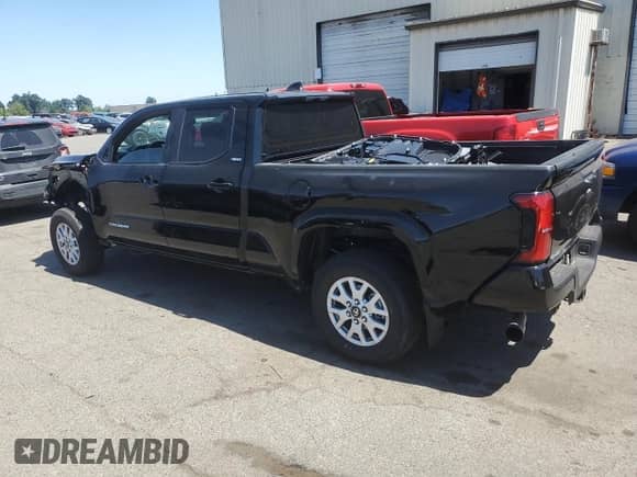 2024 Toyota Tacoma TRD Off Road with VIN 3TMLB5JN1RM085942, listed as a Copart auction lot 64483585 with 1,975 mi miles and Salvage title. Bid and sale history available at DreamBid. Image 2.