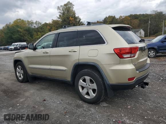 2012 Jeep Grand Cherokee Laredo z VIN 1C4RJFAG0CC156397, wystawiony jako Copart lot #87400775 z przebiegiem 165 192 mil mil oraz Szkoda całkowita • Salvage title. Historia ofert i sprzedaży dostępna na DreamBid. Obrazek 2.