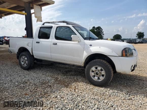 2001 Nissan Frontier SE with VIN 1N6ED27T91C344946, listed as a Copart auction lot 57488105 with 183,127 mi miles and Salvage title. Bid and sale history available at DreamBid. Image 4.