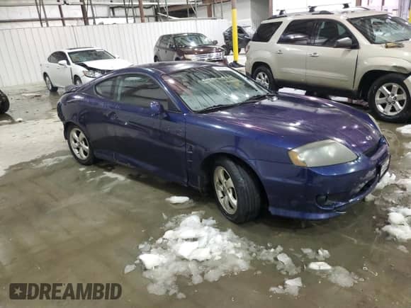 2006 Hyundai Tiburon GS с VIN KMHHM65D66U230533, выставлен на аукционе Copart как лот 87877565 с пробегом 155 039 миль миль и На запчасти • Non repairable. История ставок и продаж доступна на DreamBid. Изображение 4.