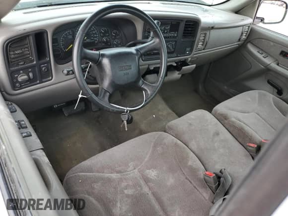 1999 GMC Sierra 1500 SL z VIN 1GTEC14V3XE544949, wystawiony jako Copart lot #68512264 z przebiegiem Nie podano mil oraz Szkoda całkowita • Salvage title. Historia ofert i sprzedaży dostępna na DreamBid. Obrazek 8.