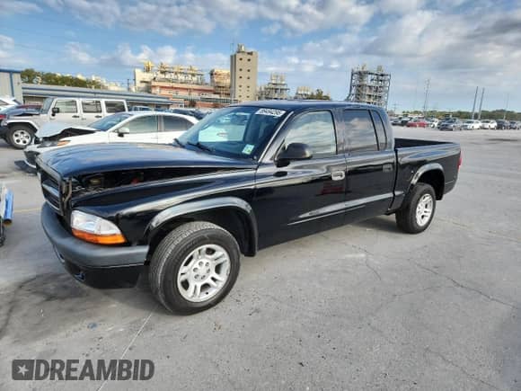 2002 Dodge Dakota Sport with VIN 1B7HL38X32S700728, listed as a Copart auction lot 89494295 with 251,036 mi miles and Salvage title. Bid and sale history available at DreamBid. Image 1.