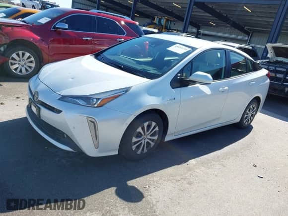 2021 Toyota Prius LE with VIN JTDL9MFU8M3029027, listed as a IAAI auction lot 43354130 with 66,497 mi miles and . Bid and sale history available at DreamBid. Image 2.