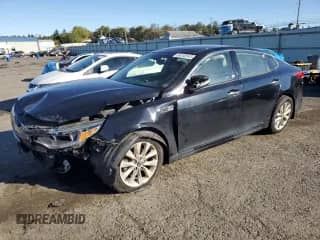 2016 Kia Optima EX with VIN 5XXGU4L35GG064155, listed as a Copart auction lot 86102545 with 201,802 mi miles and Salvage title. Bid and sale history available at DreamBid. Image 1.