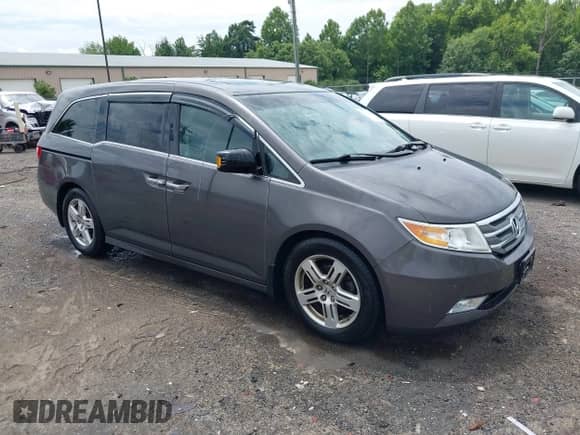 2012 Honda Odyssey Touring z VIN 5FNRL5H95CB132398, wystawiony jako IAAI lot #42789552 z przebiegiem 169 861 mil mil oraz . Historia ofert i sprzedaży dostępna na DreamBid. Obrazek 1.
