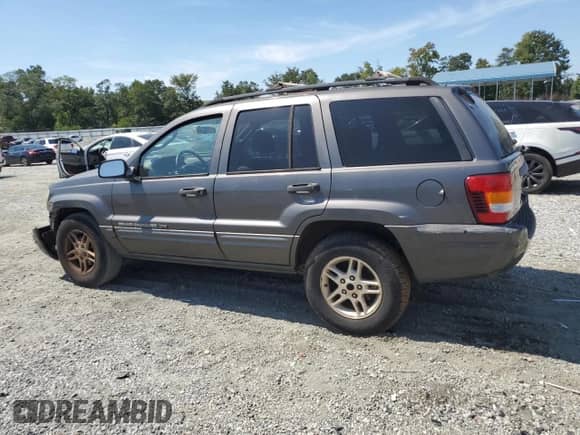2004 Jeep Grand Cherokee Laredo with VIN 1J4GX48S94C381627, listed as a Copart auction lot 70754855 with 318,672 mi miles and Salvage title. Bid and sale history available at DreamBid. Image 2.