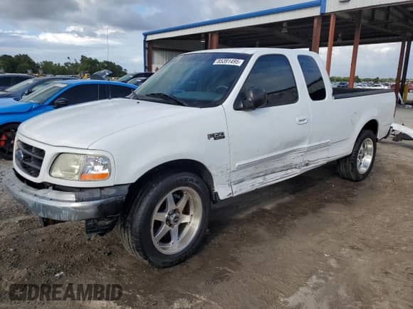 2002 Ford F-150 XL with VIN 1FTRX17LX2KC01615, listed as a Copart auction lot 85391495 with 176,921 mi miles and Salvage title. Bid and sale history available at DreamBid. Image 1.