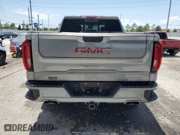 2023 GMC Sierra 1500 Denali z VIN 1GTUUGED7PZ270231, wystawiony jako Copart lot #58398935 z przebiegiem 14 572 mil mil oraz Nie do naprawy • Non repairable. Historia ofert i sprzedaży dostępna na DreamBid. Obrazek 6.