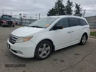 2011 Honda Odyssey Touring with VIN 5FNRL5H99BB088985, listed as a Copart auction lot 85648105 with 169,209 mi miles and Salvage title. Bid and sale history available at DreamBid. Image 1.